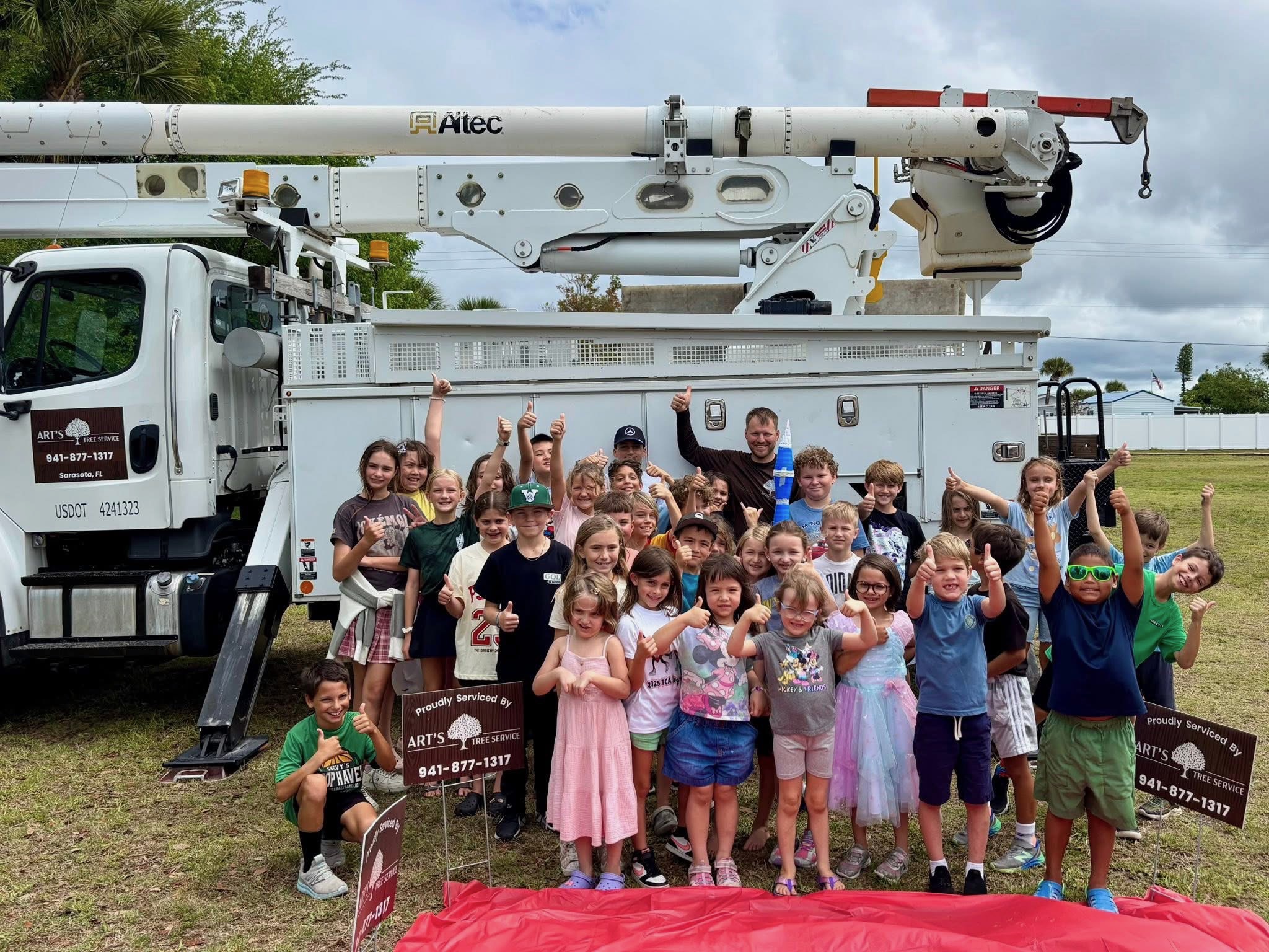 Art's Tree Service crew helping a Sarasota community member